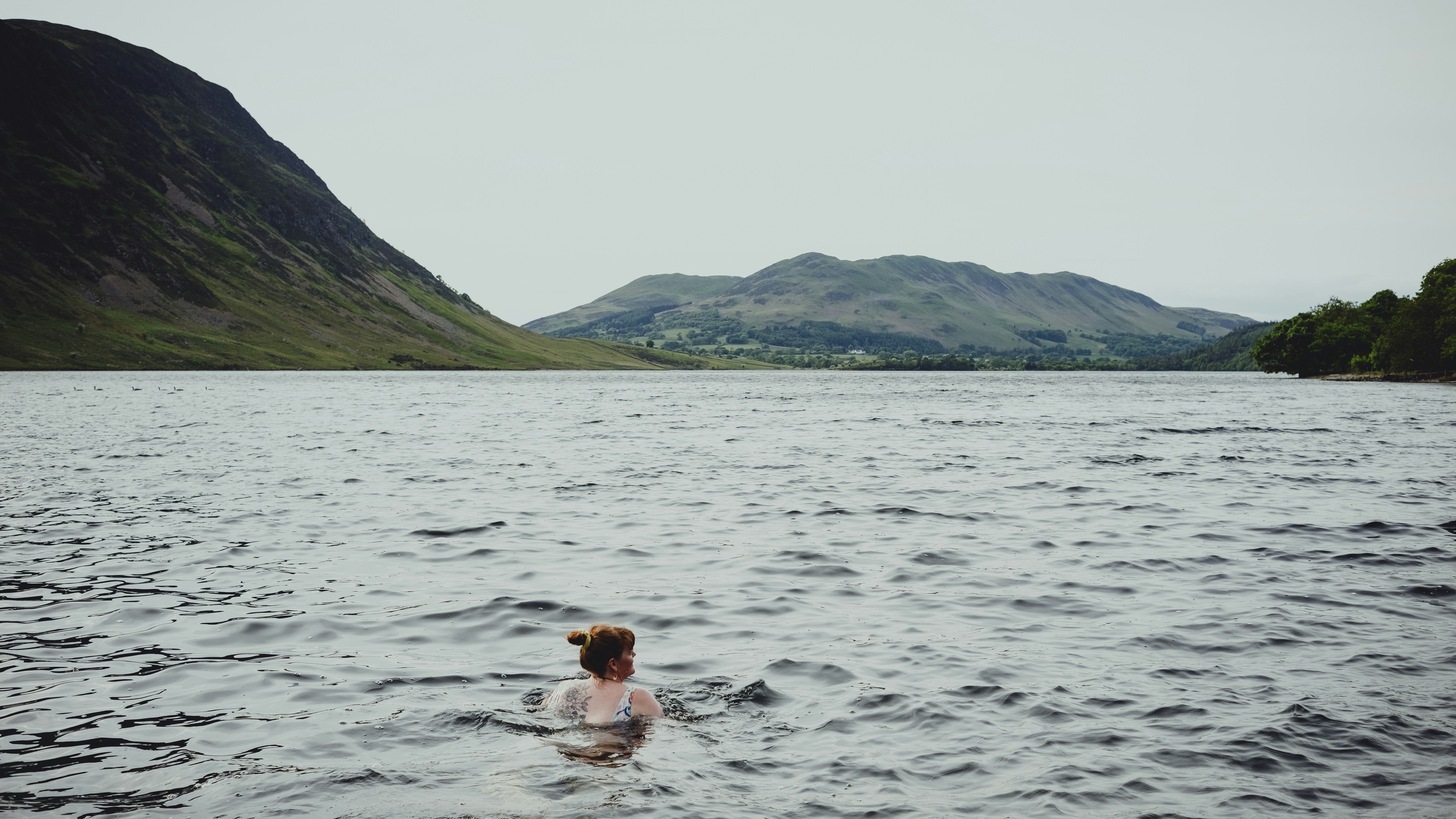 A woman swimming in the Lake District