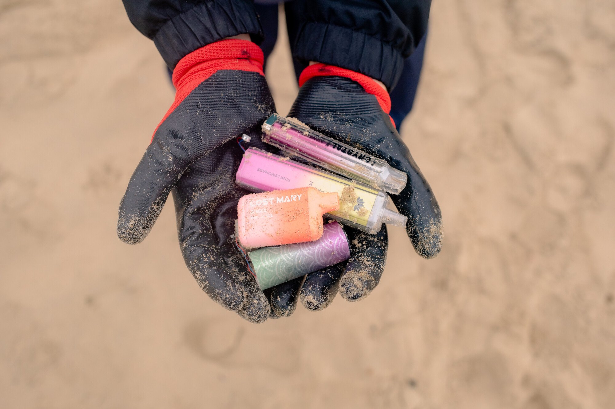A handful of disposable vapes found at a Great British Beach Clean event