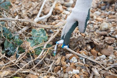 a volunteer taking part in a beach clean-up