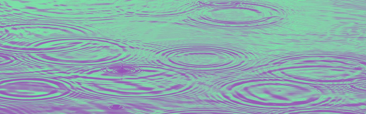 Raindrops in water with purple and green overlay to represent PFAS/forever chemicals/harmful chemicals