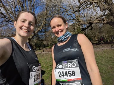 2 Bath half fundraisers smiling at the camera. They are wearing Marine Conservation Society branded clothes