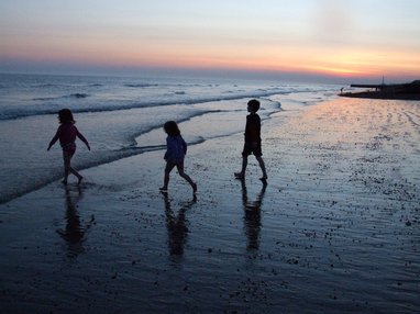 Silhouette of children on a beach
