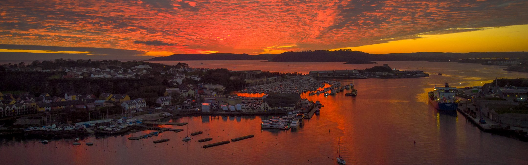 A camera shot of a sunset over th village of Oreston