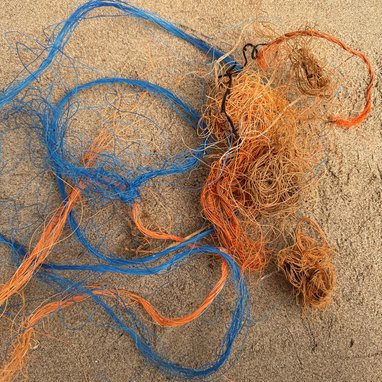 Some Blue and orange rope tangled up together