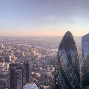 A view of the London skyline at dawn with the Gherkin in the foreground.