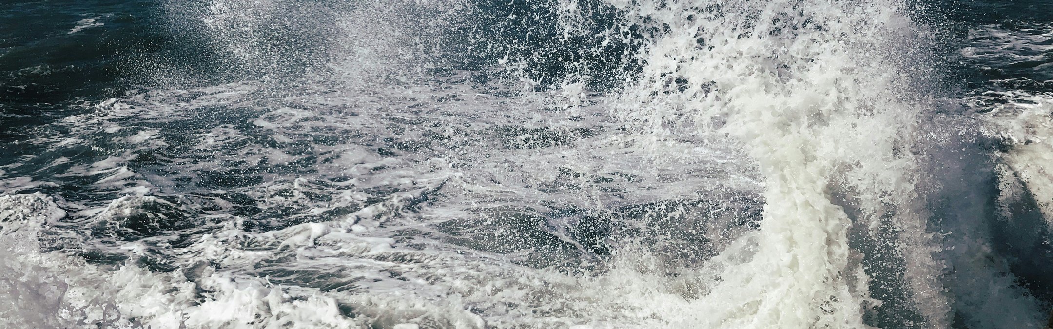 Waves crashing in open ocean.