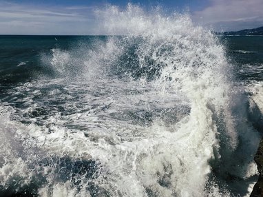 Waves crashing in open ocean.
